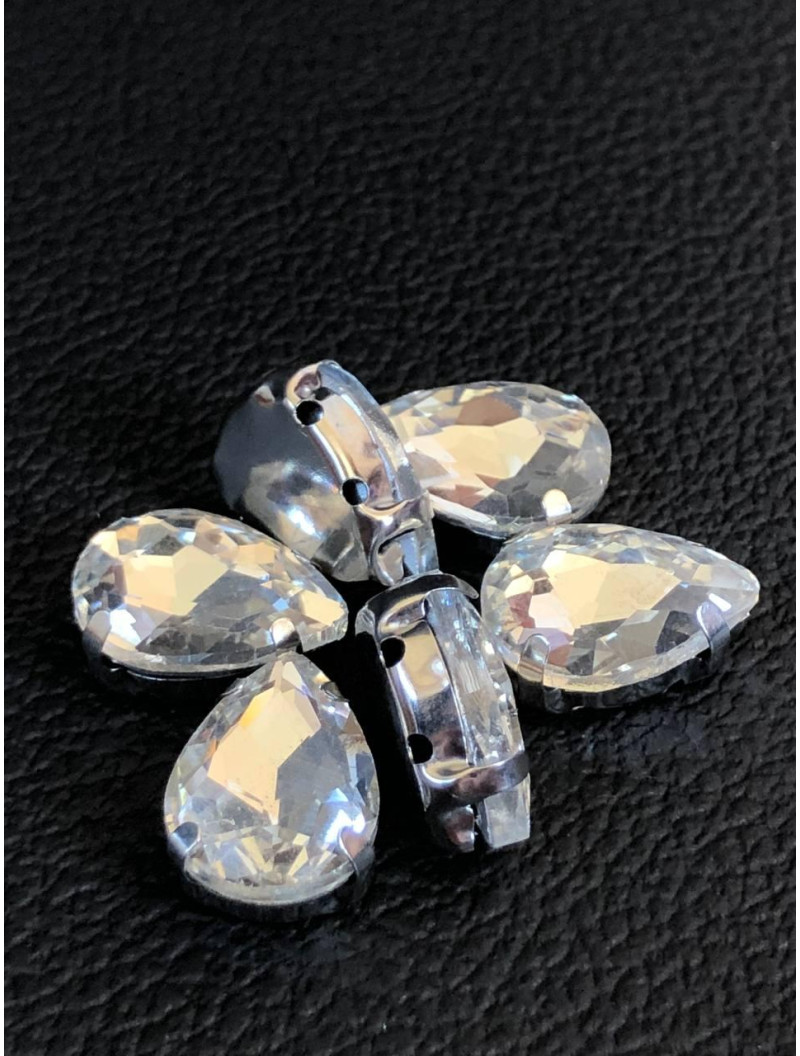 Страз (скло) в металевій оправі. Розмір — 13×18 мм. Колір світла бузок