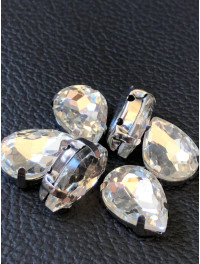 Страз (скло) в металевій оправі. Розмір — 13×18 мм. Колір світла бузок