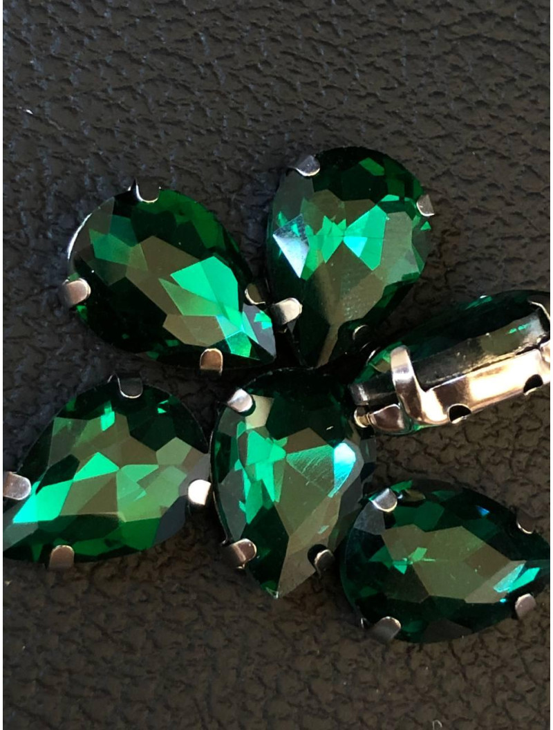 Страз (скло) в металевій оправі. Розмір — 10×14  мм. Колір бірюзовий