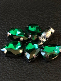 Страз (скло) в металевій оправі. Розмір — 10×14  мм. Колір бірюзовий