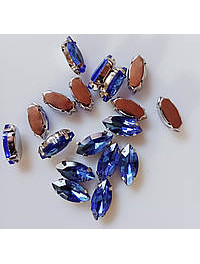 Страз (скло) в металевій оправі. Розмір  7×15 мм. Колір світло-синій