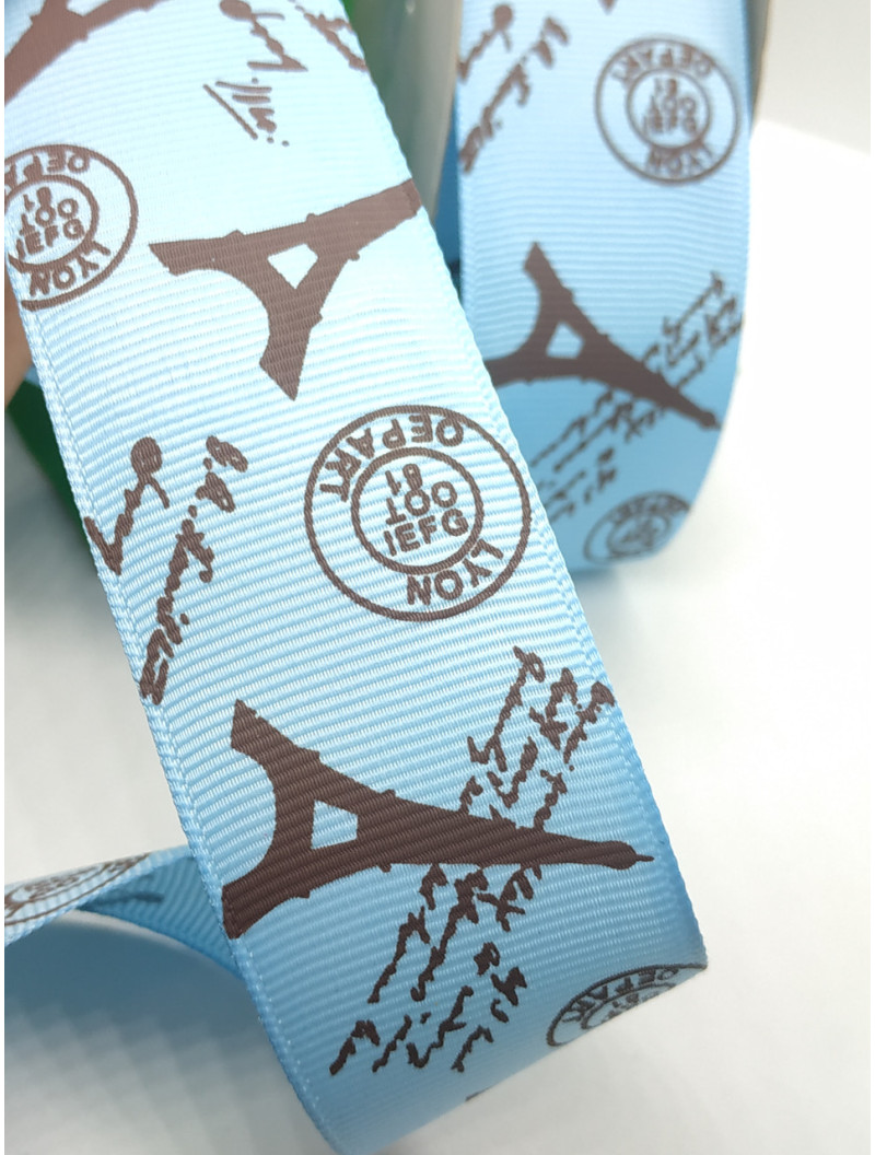 Репсова стрічка. Ширина  4 см. Колір  чорні вежі на блакитному тлі. Ціна вказана за 1 метр