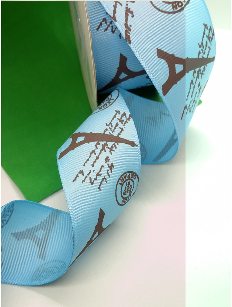 Репсова стрічка. Ширина  4 см. Колір  чорні вежі на блакитному тлі. Ціна вказана за 1 метр