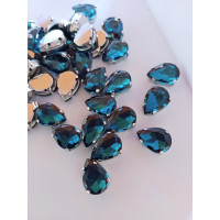 Страз (скло) в металевій оправі. Розмір  10×14 мм. Колір  бірюза