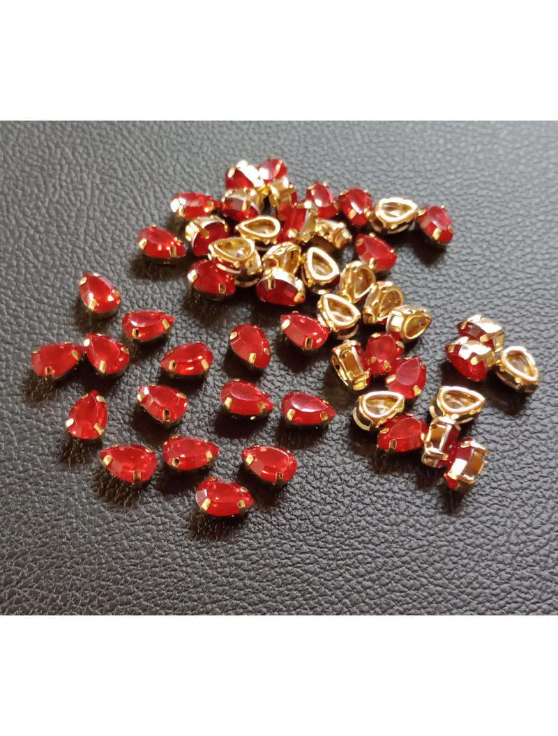 Стразі (акрил) у золотій металевій оправі. Розмір  6*10 мм. Колір червоний опал