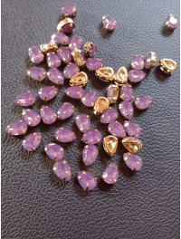 Стразі (акрил) у золотій металевій оправі. Розмір  6*10 мм. Колір  бузок світлий опал