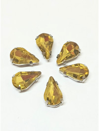 Страз (скло) в металевій оправі. Розмір  8×13 мм. Колір темно-жовтий