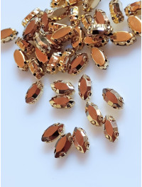 Страз (скло) в золотій металевій оправі 2. Розмір — 5×10 мм. Колір — гальванічне золото. 5 шт.